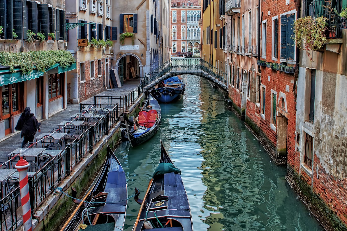 Venice canal view in autumn with warm golden light reflecting off ochre building facades