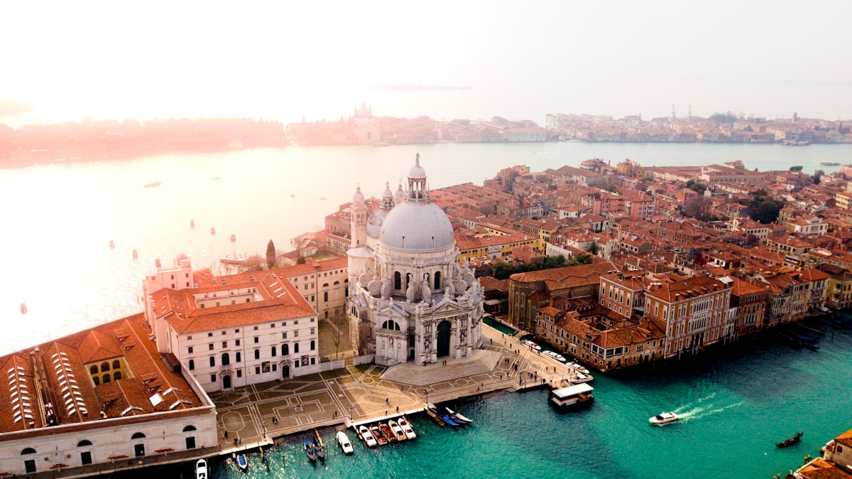 Passengers standing in a traghetto gondola crossing the Grand Canal